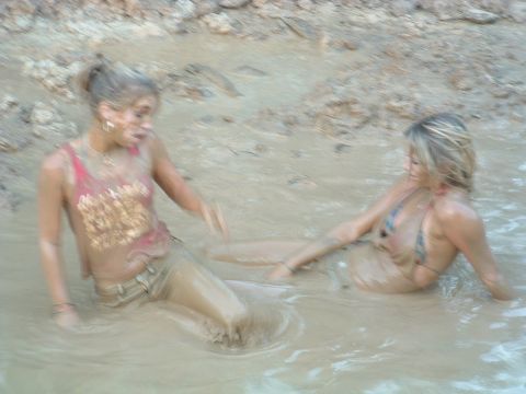 1993 Ford Bronco - Two women are playing in a mud pit.