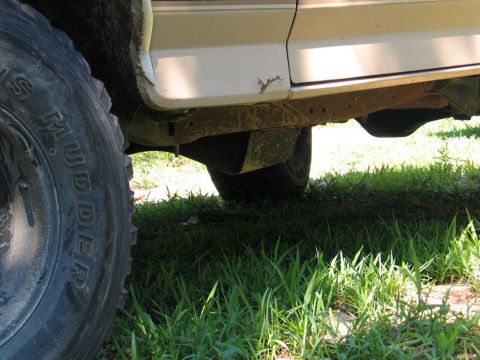1995 Ford Bronco - Undercarriage view of an off-road vehicle, showing the frame and suspension components.