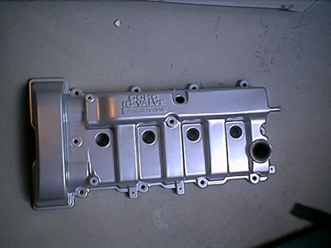 1996 Ford Probe - Silver engine valve cover with DOHC 16 VALVE text visible.