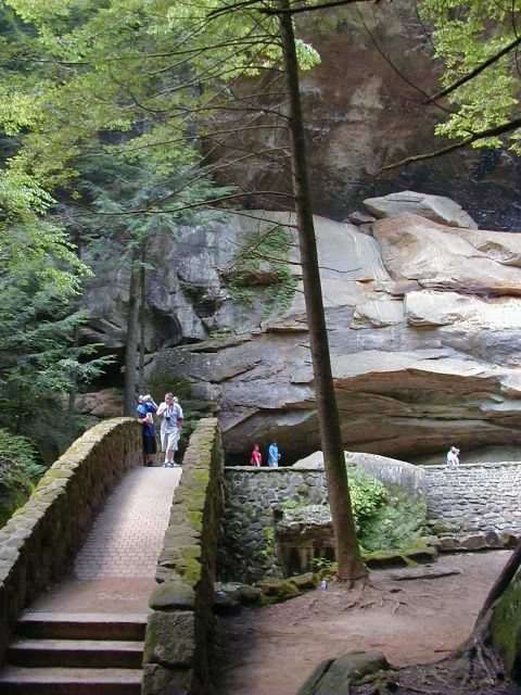 1994 Ford Probe - A scenic view of a stone bridge and natural rock formations with people enjoying the outdoors.