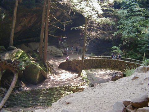 1994 Ford Probe - A scenic view of a stone bridge and pathway in a natural gorge with trees and rocks.