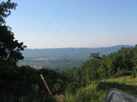 1995 Ford Bronco - A scenic view of a valley from a high vantage point, with power lines overhead.