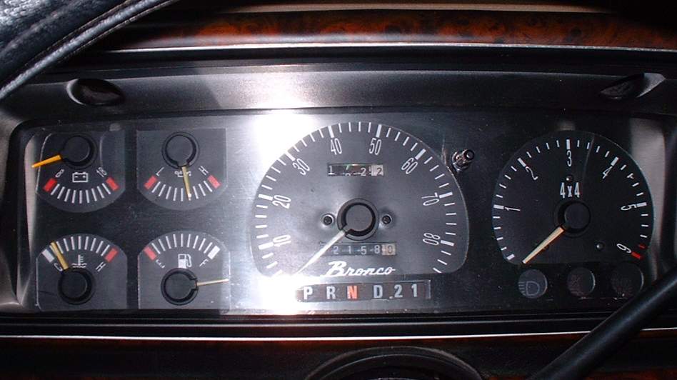 Ford Bronco gauge cluster with speedometer, tach with 4x4 light, four small gauges, and PRND21 indicator showing N