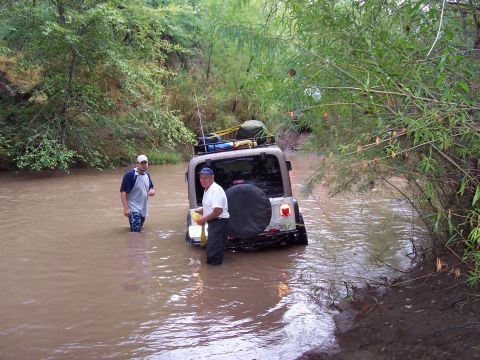 1981 Ford F-150 - Earl got high-centered on a big rock hidden under the water