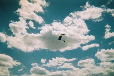 1972 Ford Ranchero - Skydivers are seen falling through a cloudy sky.