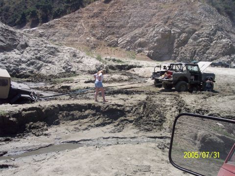 1985 Ford Bronco - didnt understand this...two trucks trying to yank him thru the mud.