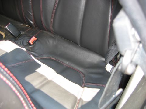 1993 Ford Probe - Interior view of car seats with red stitching and seatbelts, showing a watermark at the bottom right.