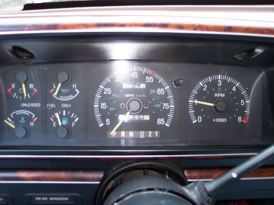 Dashboard gauges of a 1992 Ford Bronco, showing speedometer, tachometer, fuel, and oil levels