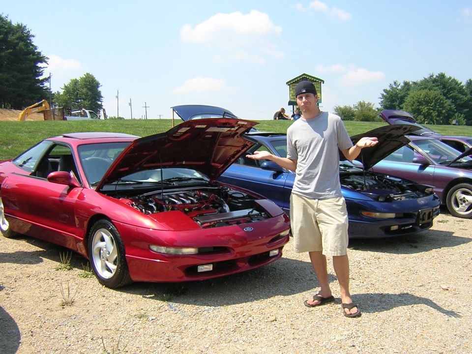 Red 1995 Ford Probe with hood open, 3/4 front view