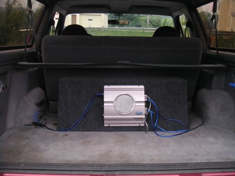 1994 Ford Bronco - Subwoofer and amplifier installed in the cargo area of a 1994 Ford Bronco.