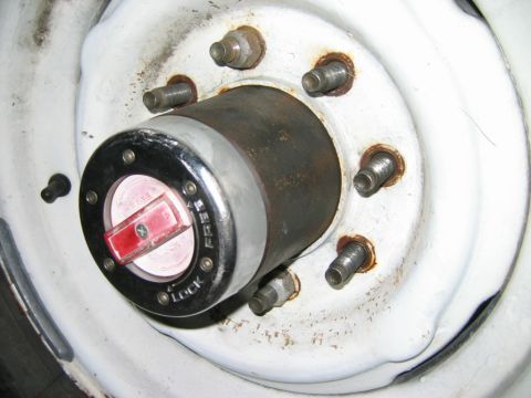 1985 Ford Bronco - Close-up of a vehicle's wheel hub, a manual locking mechanism for four-wheel drive.
