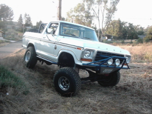 1978 Ford Bronco - This 1978 Ford Bronco is shown from a three-quarter front angle on a dirt incline.