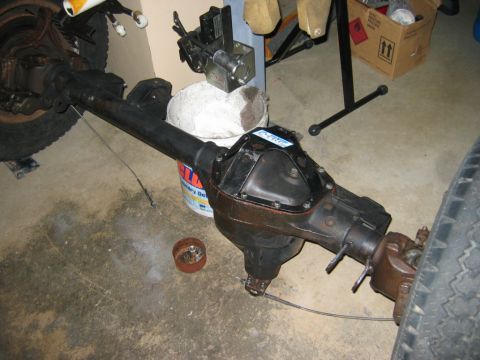 1985 Ford Bronco - Rear axle assembly, likely from a truck or SUV, shown in a workshop setting.
