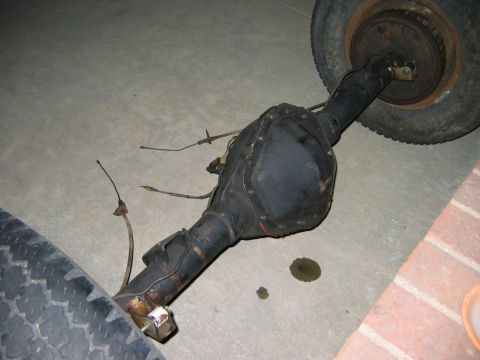 1985 Ford Bronco - This image shows a rear axle assembly, not a complete vehicle, with two tires attached.