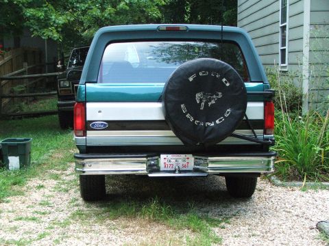 1996 Ford Bronco - Rear view of a 1996 Ford Bronco, showing its distinctive body style and spare tire.