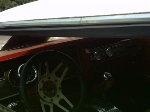 1978 Ford Mustang II - Interior view of a 1978 Ford Mustang II, its dashboard and a custom steering wheel.