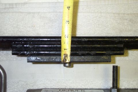 2002 Ford Excursion - A close-up view of a leaf spring with a tape measure for scale.