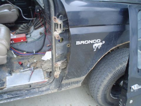 1981 Ford Bronco - 13MM socket and a ratchet is all it takes to remove the 4 bolts holding the door on.