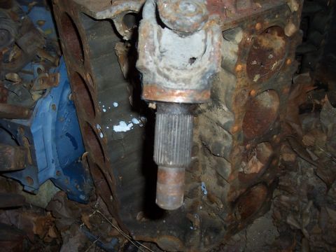 1994 Ford F-150 - Close-up of a corroded engine block and a component of the driveshaft.