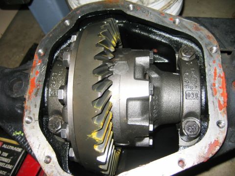 1985 Ford Bronco - Close-up view of a vehicle's differential housing, revealing internal gears and casting marks.