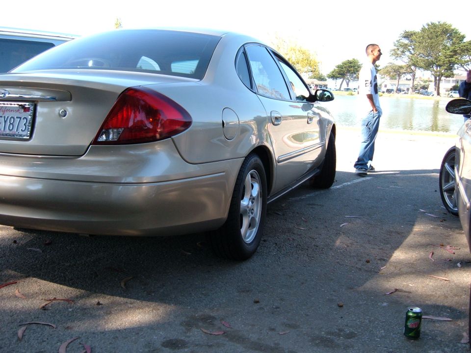 Gold sedan rear view, license plate FY873