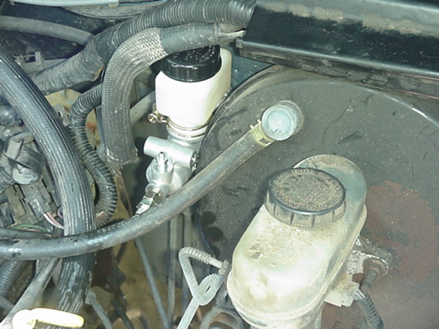 Brake master cylinder and reservoir in engine bay