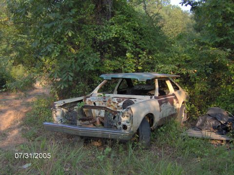 1978 Ford Bronco - This 1978 Ford Pinto is heavily rusted and abandoned in a wooded area, missing its front end.