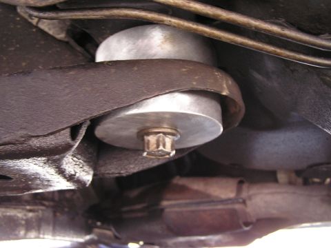 1993 Ford Taurus - Aftermarket spacer installed on a vehicle's subframe, visible from underneath.