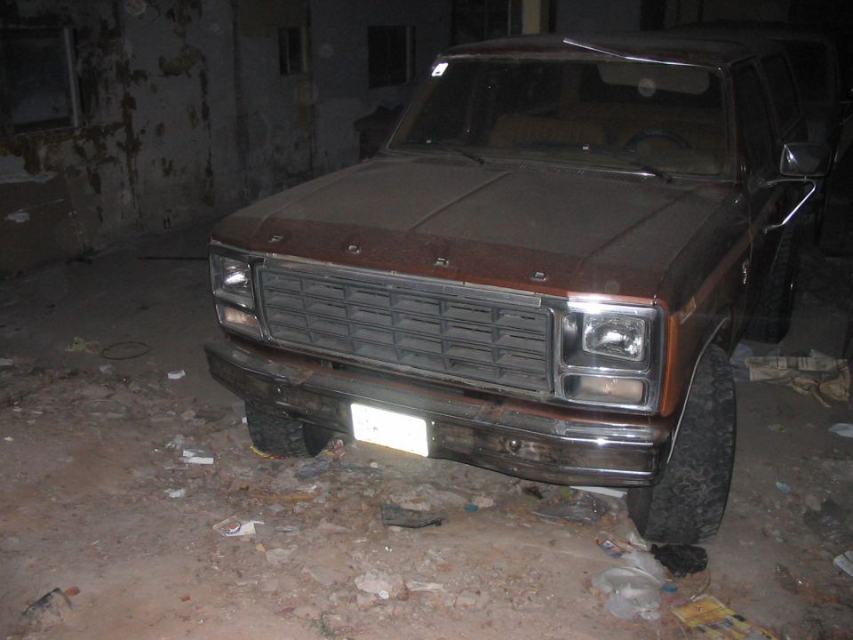 Brown Ford Bronco with chrome grille and bumper, front view