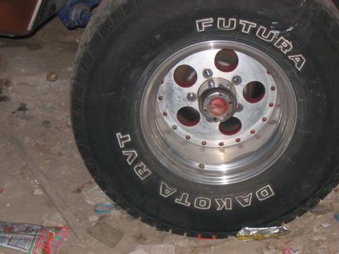 1986 Ford Bronco - A single tire and wheel assembly is shown, with visible brand names on the tire.