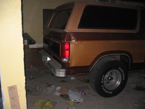 1986 Ford Bronco - This SUV, likely from the early 1980s, is seen from the rear in a garage setting.