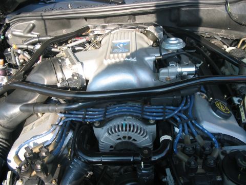 1986 Ford Bronco - Close-up view of a vehicle's engine bay, showing various components and wiring.