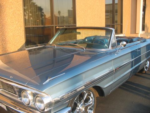1986 Ford Bronco - This blue 1964 Ford Galaxie convertible features a distinctive body style and chrome accents.