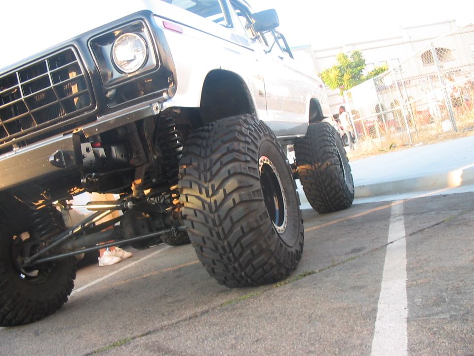 Lifted truck with large off-road tires, front view