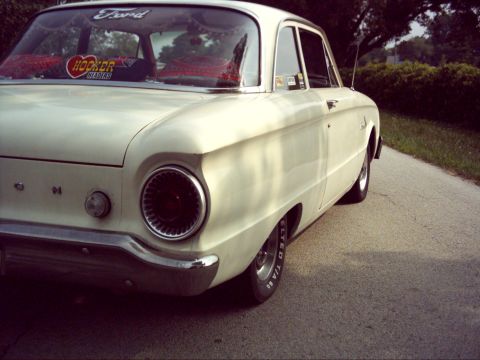1962 Ford Falcon - The rear of a vintage Ford Falcon shows its distinctive taillight and chrome bumper.