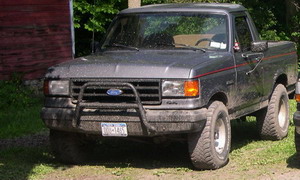 1989 Ford Bronco - This 1989 Ford Bronco is parked outside a red barn.