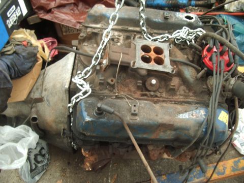 1978 Ford Bronco - Engine block with carburetor and distributor, ready for installation or removal.