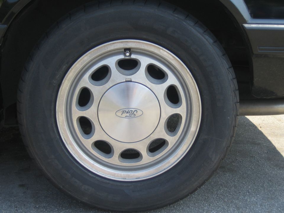 Ford 10-hole aluminum wheel with Ford oval center cap on a BFGoodrich tire