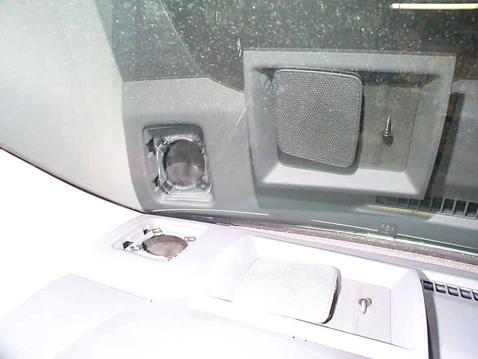 Dashboard speaker grilles and mounting points, one grille is mesh, the other is a square opening