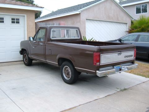 1985 Ford Ranger - This brown 1985 Ford Ranger pickup truck is parked in a driveway next to a garage.