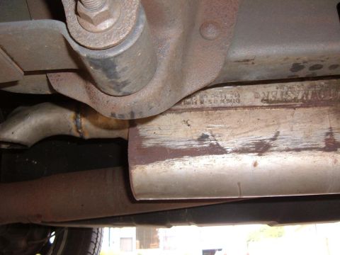 1985 Ford Ranger - Close-up of a Flowmaster exhaust component, showing rust and weld marks.