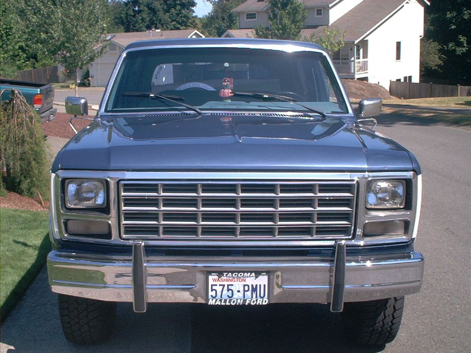 1980 Ford Bronco front view, blue exterior, chrome grille and bumper