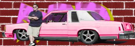 1985 Ford LTD Crown Victoria - Pink 1985 Ford Crown Victoria with custom wheels and a man posing beside it.