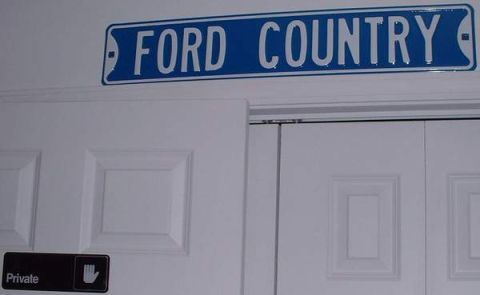 2006 Ford E350 - Keeping it real! This is the door to my room with the "Private" sign and the "Ford Country" sign I bought, above my closet.