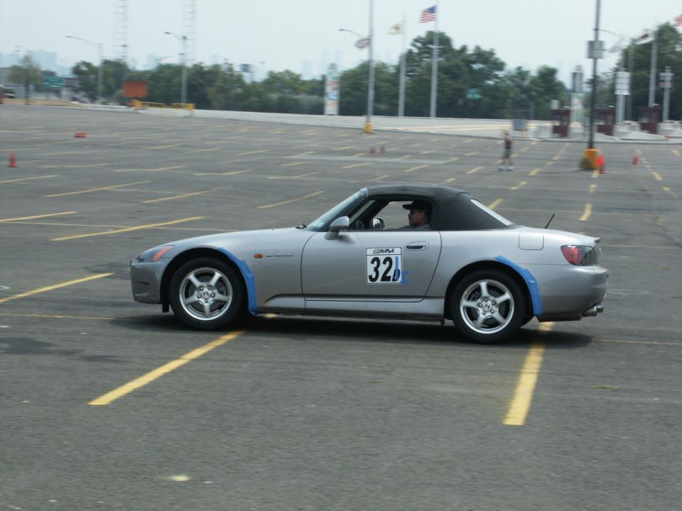 Silver Honda S2000 convertible, top up, numbered 32, on an autocross course