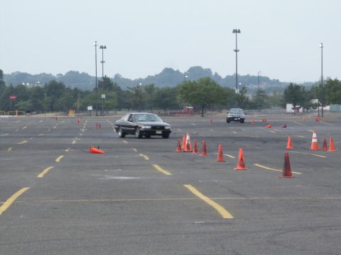 2001 Mercury Grand Marquis - Autocross event in progress with multiple vehicles navigating the course.