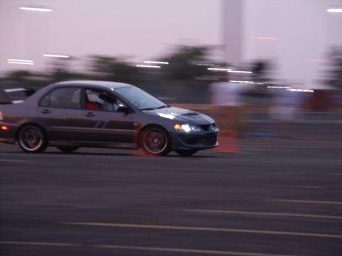 2001 Mercury Grand Marquis - Mitsubishi Lancer Evolution seen on a track with motion blur.