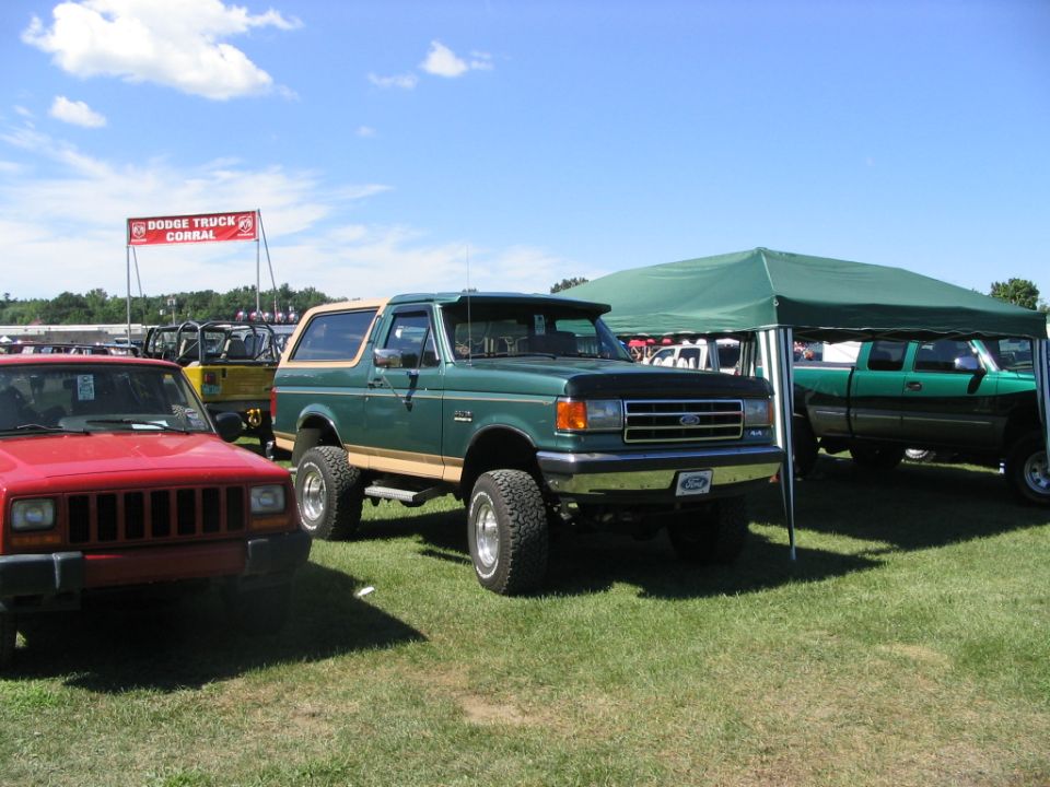 Green Ford Bronco with tan trim, 3q-front view