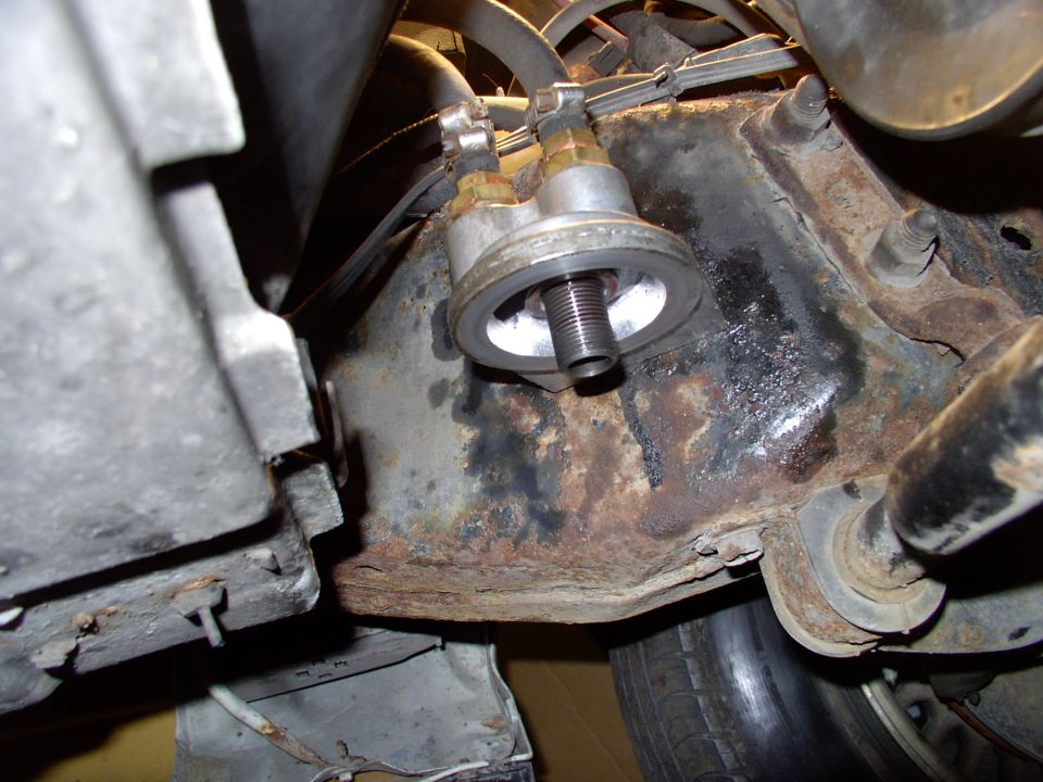 After the frame rail is drilled and tapped, just bolt the unit to the frame and run the hoses.