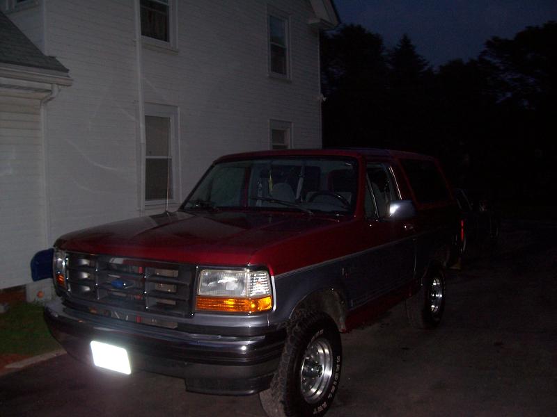 1994 Ford Bronco 3q-front view, red and grey exterior